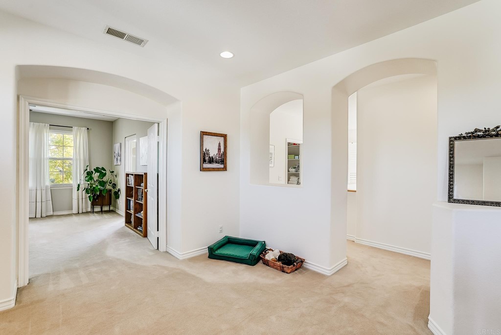 8046 Calle Pinon Carlsbad, CA 92009 - Photo 24 of 51 a view of livingroom with hardwood floor and a ceiling fan