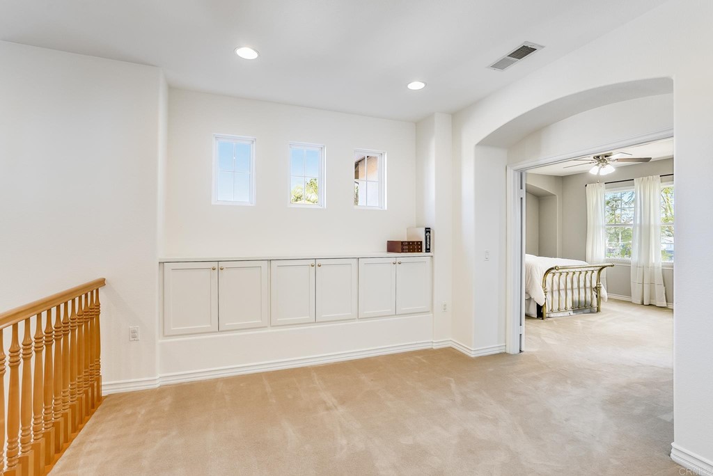8046 Calle Pinon Carlsbad, CA 92009 - Photo 25 of 51 a view of a livingroom with a couch
