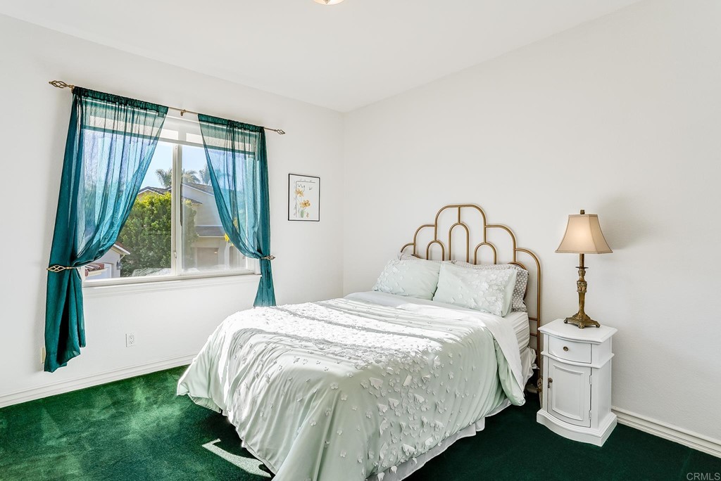 8046 Calle Pinon Carlsbad, CA 92009 - Photo 33 of 51 a bedroom with a bed and a window