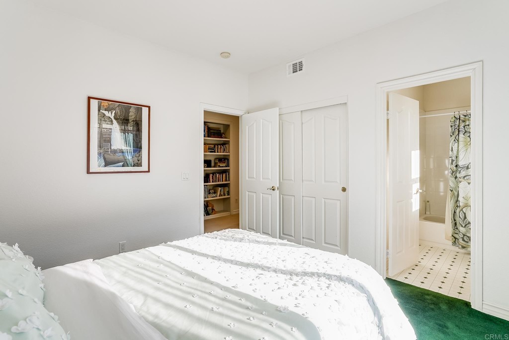 8046 Calle Pinon Carlsbad, CA 92009 - Photo 34 of 51 a bedroom with a bed and a window