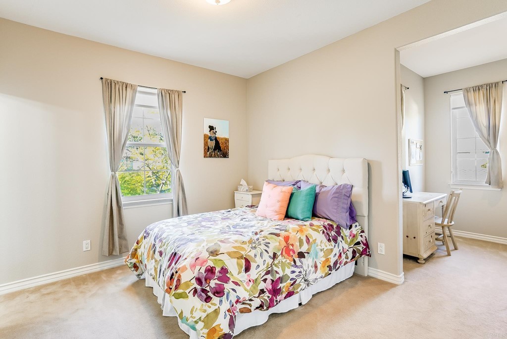 8046 Calle Pinon Carlsbad, CA 92009 - Photo 36 of 51 a bedroom with a bed and a window