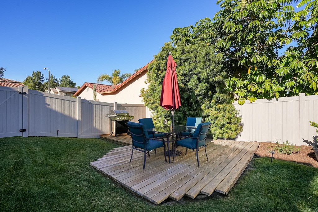 8046 Calle Pinon Carlsbad, CA 92009 - Photo 48 of 51 a view of a backyard with a sitting area furniture and a garden