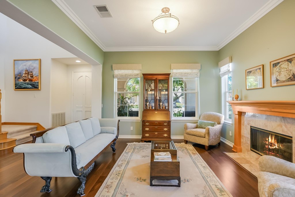 8046 Calle Pinon Carlsbad, CA 92009 - Photo 8 of 51 a living room with furniture or couch and a fireplace