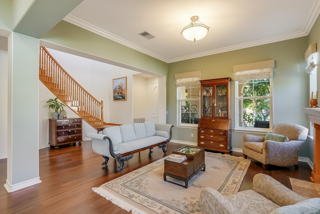 8046 Calle Pinon Carlsbad, CA 92009 - Photo 9 of 51 a living room with furniture and a potted plant