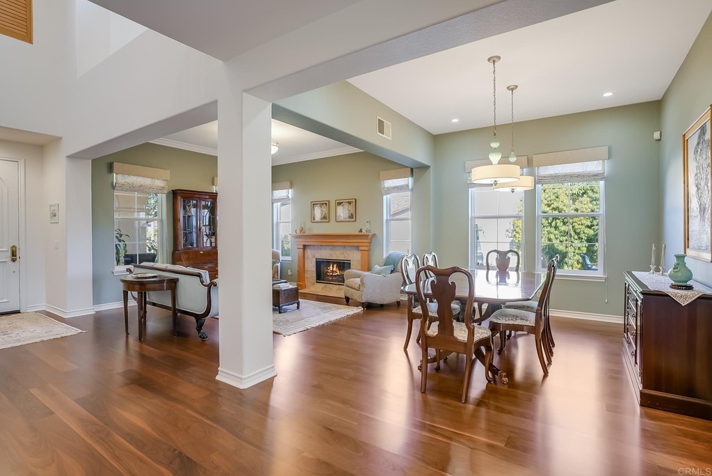 8046 Calle Pinon Carlsbad, CA 92009 - Photo 10 of 51 a living room with fireplace furniture and a large window