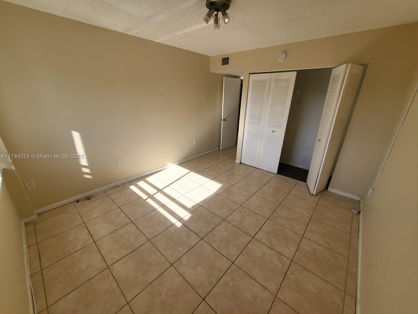 711 North Pine Island Road, Unit 407 Plantation, FL 33324 - Photo 6 of 11 a view of an empty room and a window