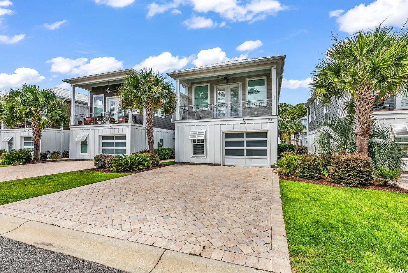 202 Clam Digger Loop Pawleys Island, SC 29585 - Photo 2 of 28 View of front of property featuring board and batt