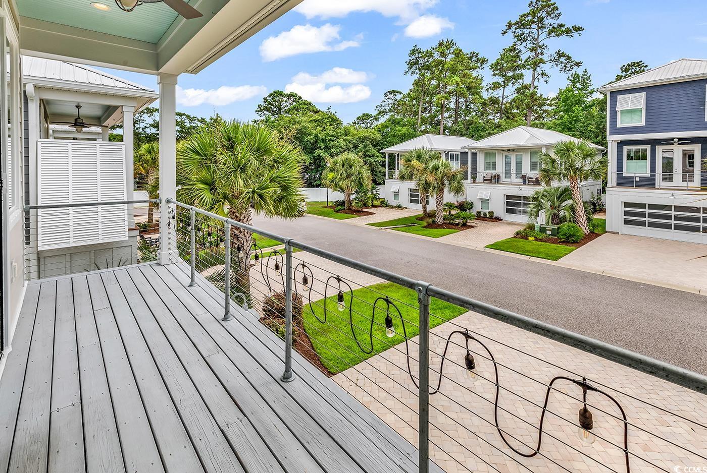 202 Clam Digger Loop Pawleys Island, SC 29585 - Photo 23 of 28 Wooden terrace featuring ceiling fan