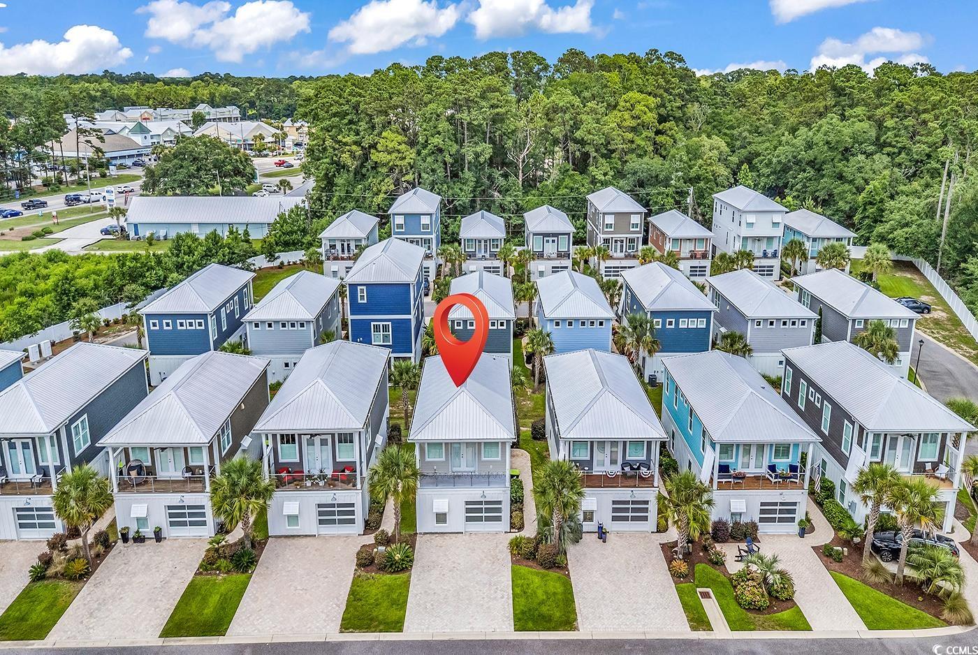 202 Clam Digger Loop Pawleys Island, SC 29585 - Photo 24 of 28 Aerial perspective of suburban area featuring a fo