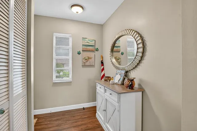 a bathroom with a sink mirror and vanity