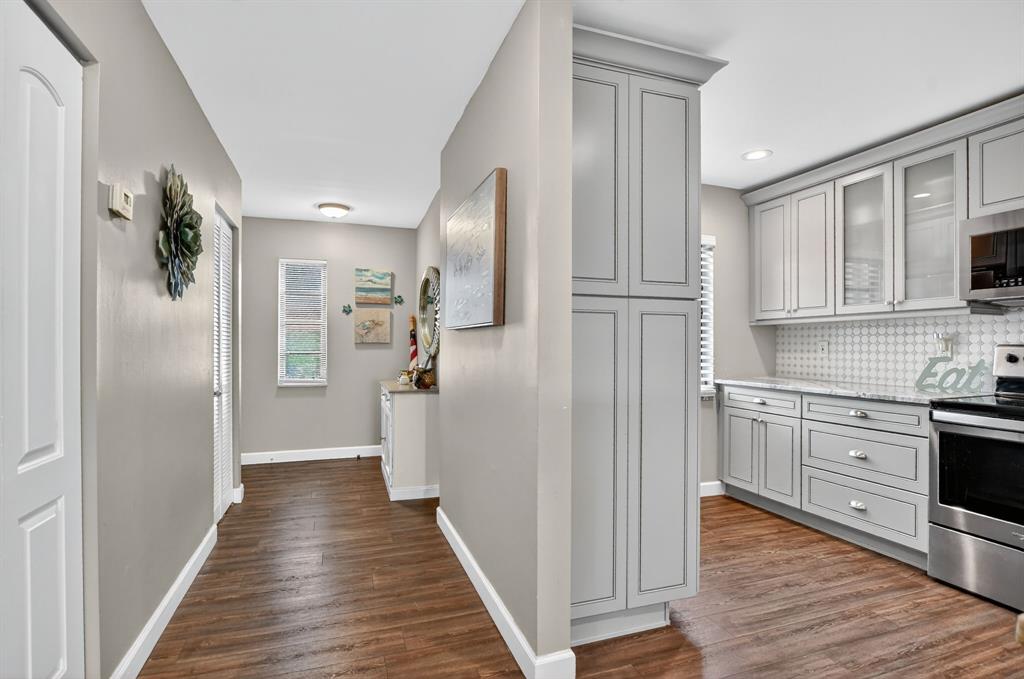 21219 Lago Circle, Unit J5 Boca Raton, FL 33433 - Photo 12 of 46 a bathroom with a sink and a mirror