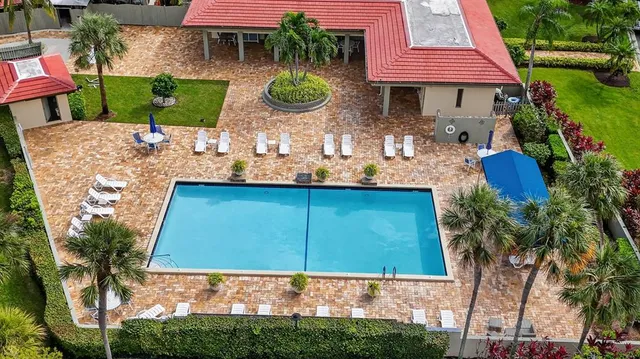 a backyard of a house with seating space and a garden