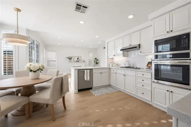 a bathroom with a double vanity sink mirror and shower