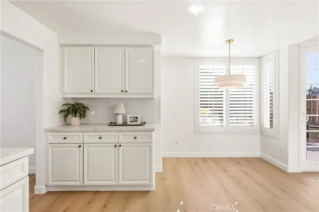 a bathroom with a double vanity sink a large mirror and shower