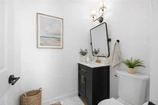 a bathroom with a double vanity sink mirror and bathtub