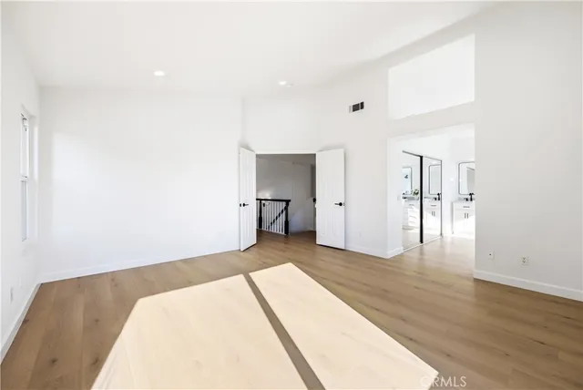 a bathroom with a double vanity sink a toilet and a mirror
