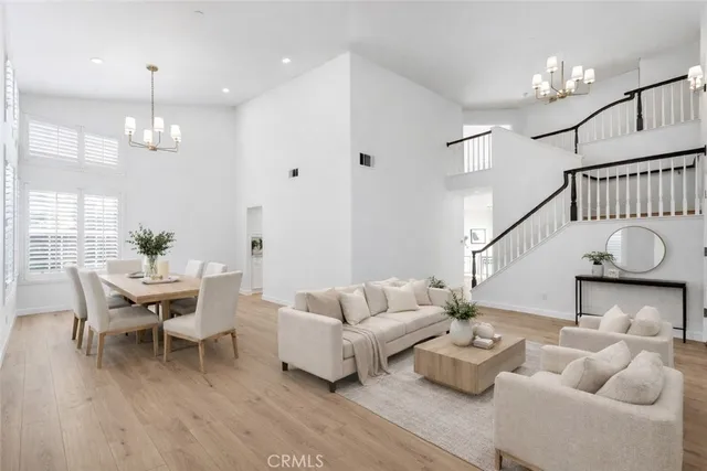 a view of a kitchen with granite countertop a refrigerator and a sink