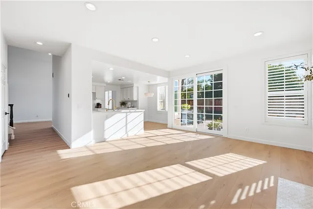 a view of a kitchen with white cabinets
