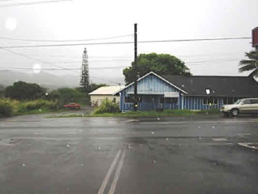 4221 Opu Road Kalaheo, HI 96741 - Photo 4 of 13 a front view of a house with a yard and garage