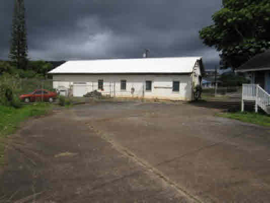 4221 Opu Road Kalaheo, HI 96741 - Photo 8 of 13 a front view of a house with a yard and garage