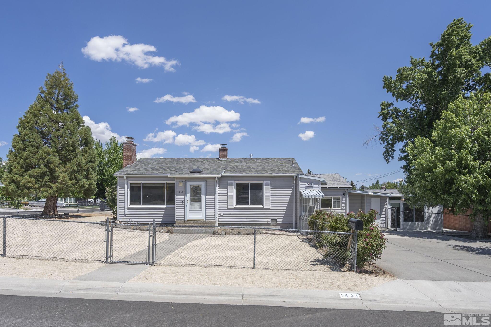 1445 University Terrace Reno, NV 89503 - Photo 1 of 17 a view of a house with a patio