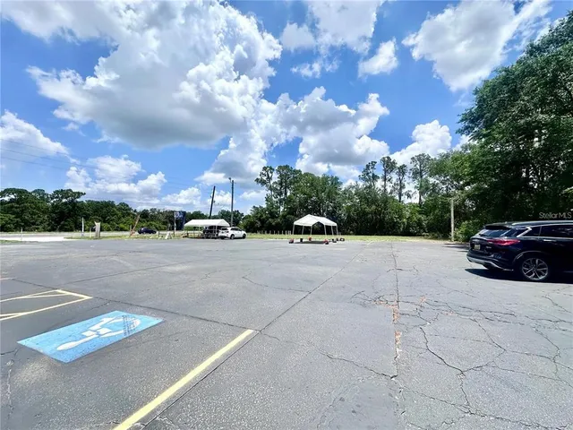 a view of street with parked cars