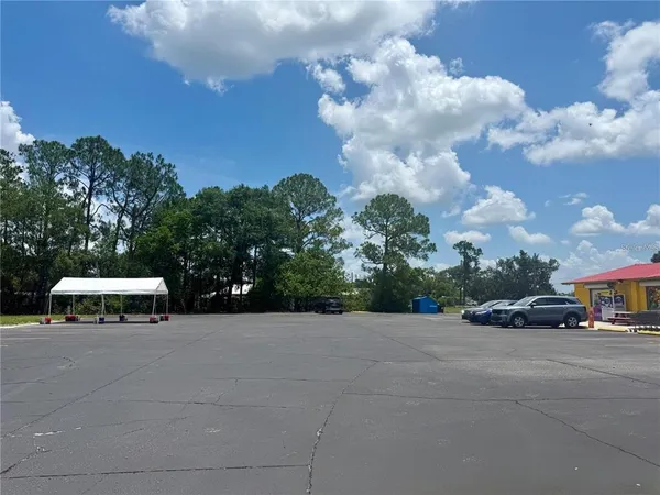 a view of street with parked cars