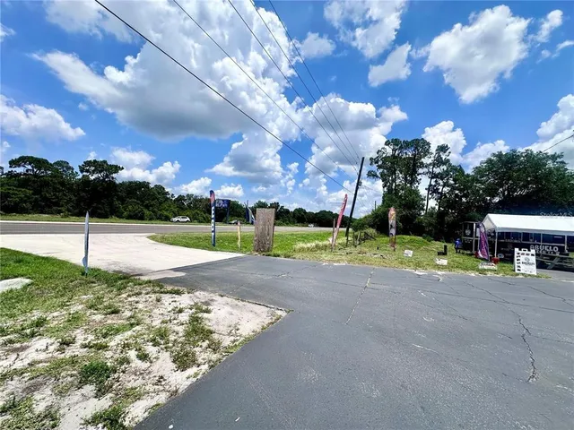 a view of a house with basketball court