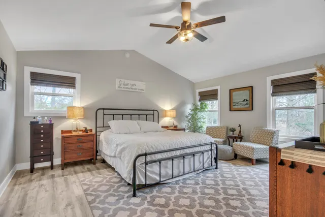 a bedroom with a bed and dresser