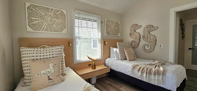 a bedroom with bed and a window