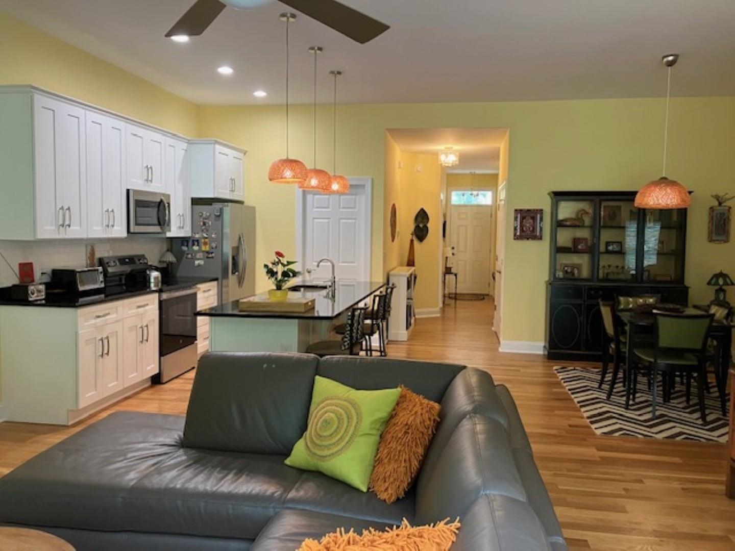 1203 Stocker Street Staunton, VA 24401 - Photo 12 of 35 a living room with furniture kitchen view and a wooden floor
