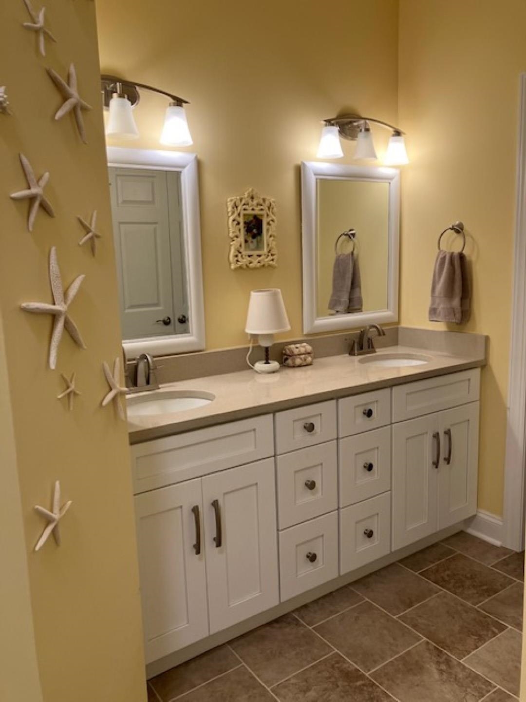 1203 Stocker Street Staunton, VA 24401 - Photo 18 of 35 a bathroom with a double vanity sink and mirror