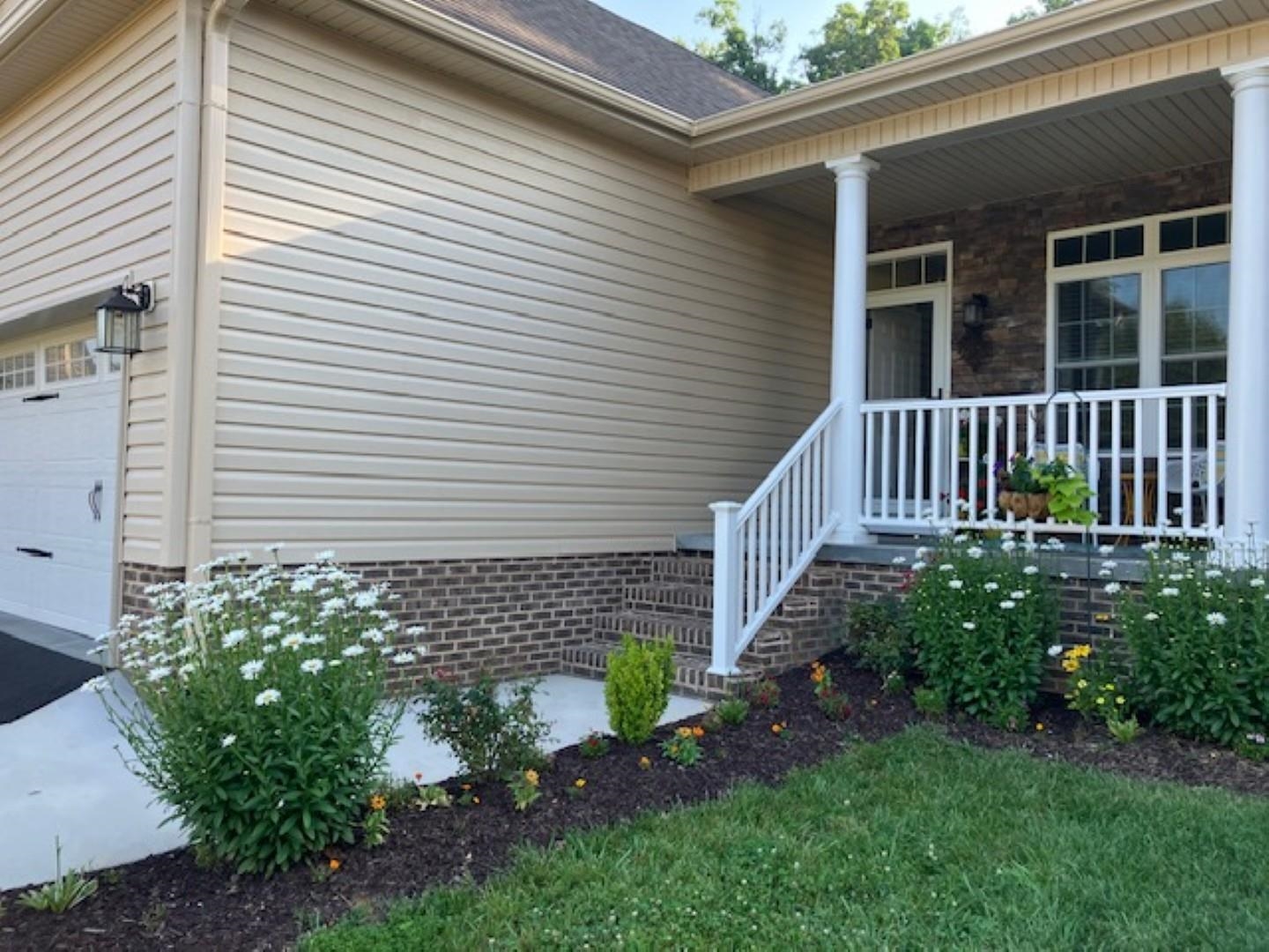 1203 Stocker Street Staunton, VA 24401 - Photo 2 of 35 a view of a house with a yard and a garden