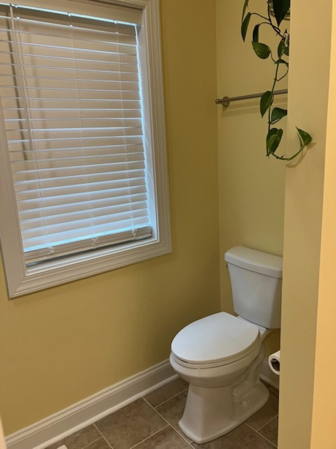 1203 Stocker Street Staunton, VA 24401 - Photo 21 of 35 a white toilet sitting next to a window