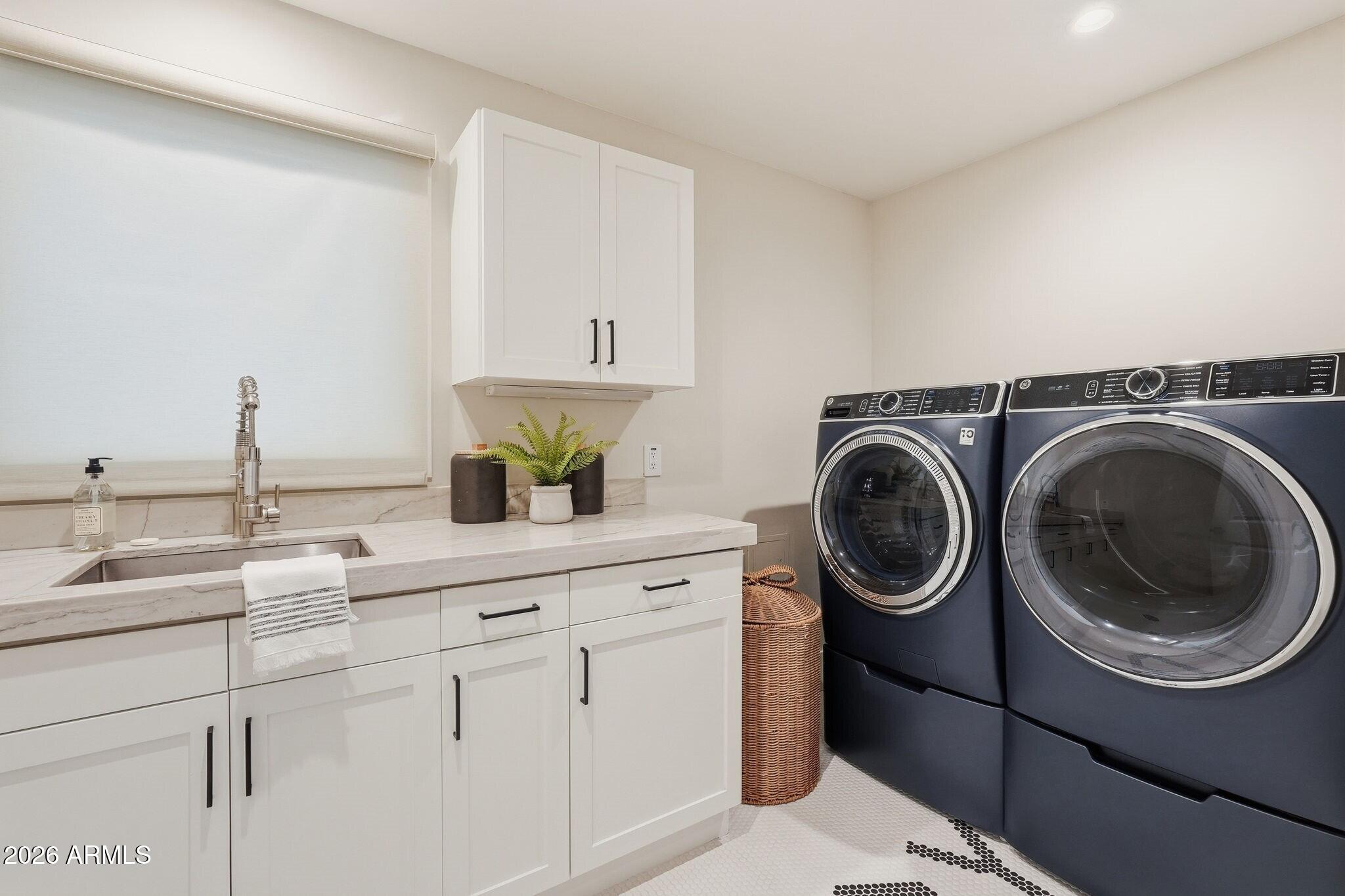 7475 East Gainey Ranch Road, Unit 7 Scottsdale, AZ 85258 - Photo 42 of 77 a utility room with sink dryer and washer
