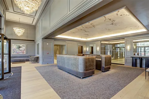 a view of a living room and kitchen with furniture