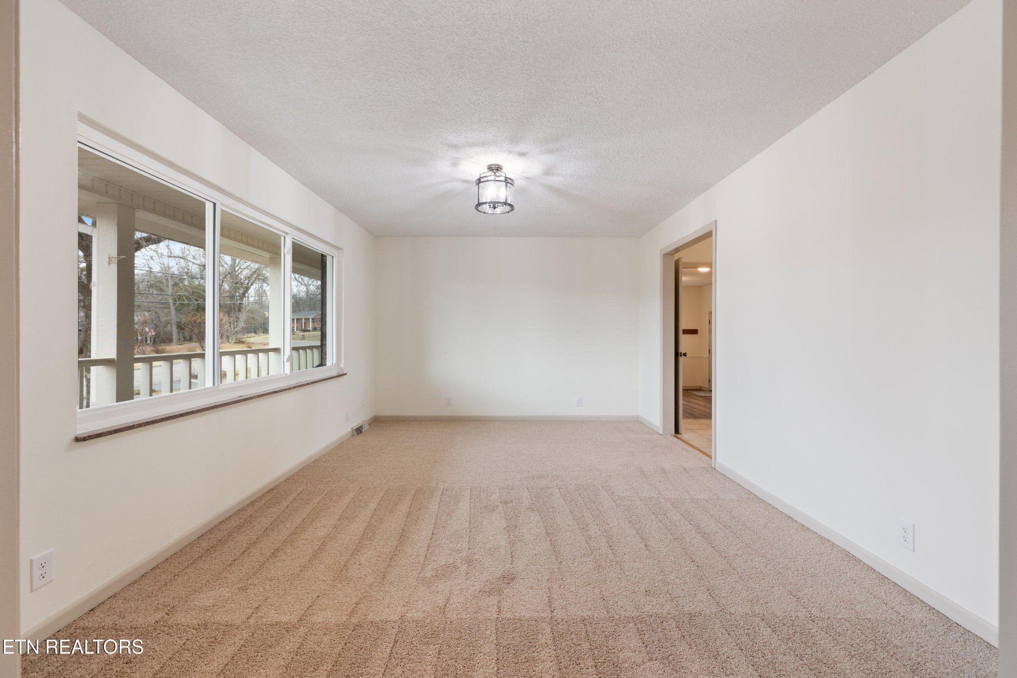 912 Naples Road Knoxville, TN 37923 - Photo 11 of 49 a view of an empty room with a window