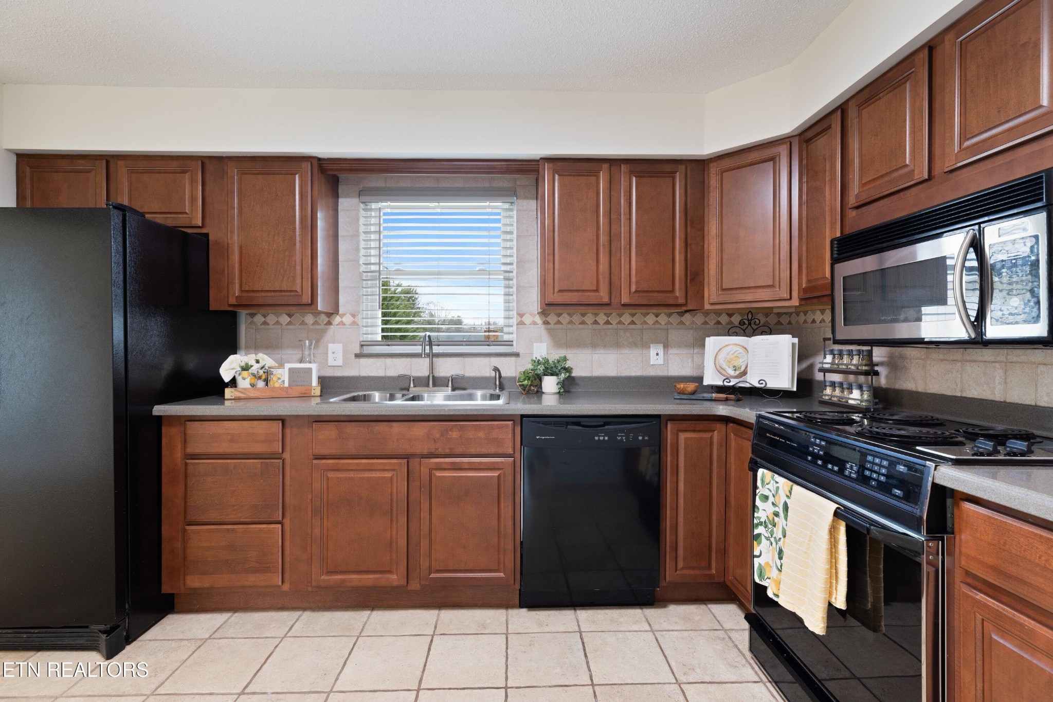 912 Naples Road Knoxville, TN 37923 - Photo 21 of 49 a kitchen with a sink stove and refrigerator