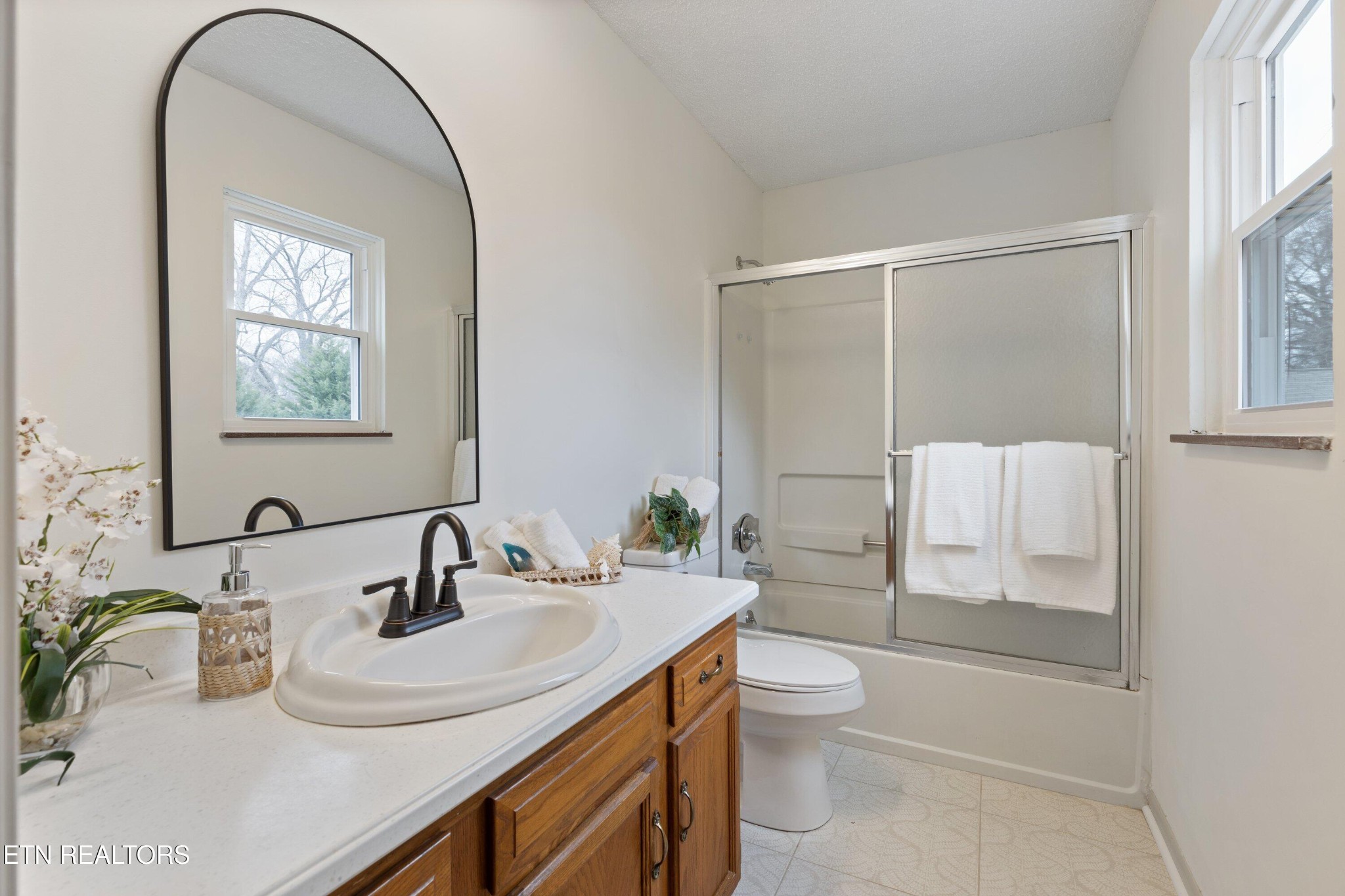 912 Naples Road Knoxville, TN 37923 - Photo 25 of 49 a bathroom with a sink toilet and shower