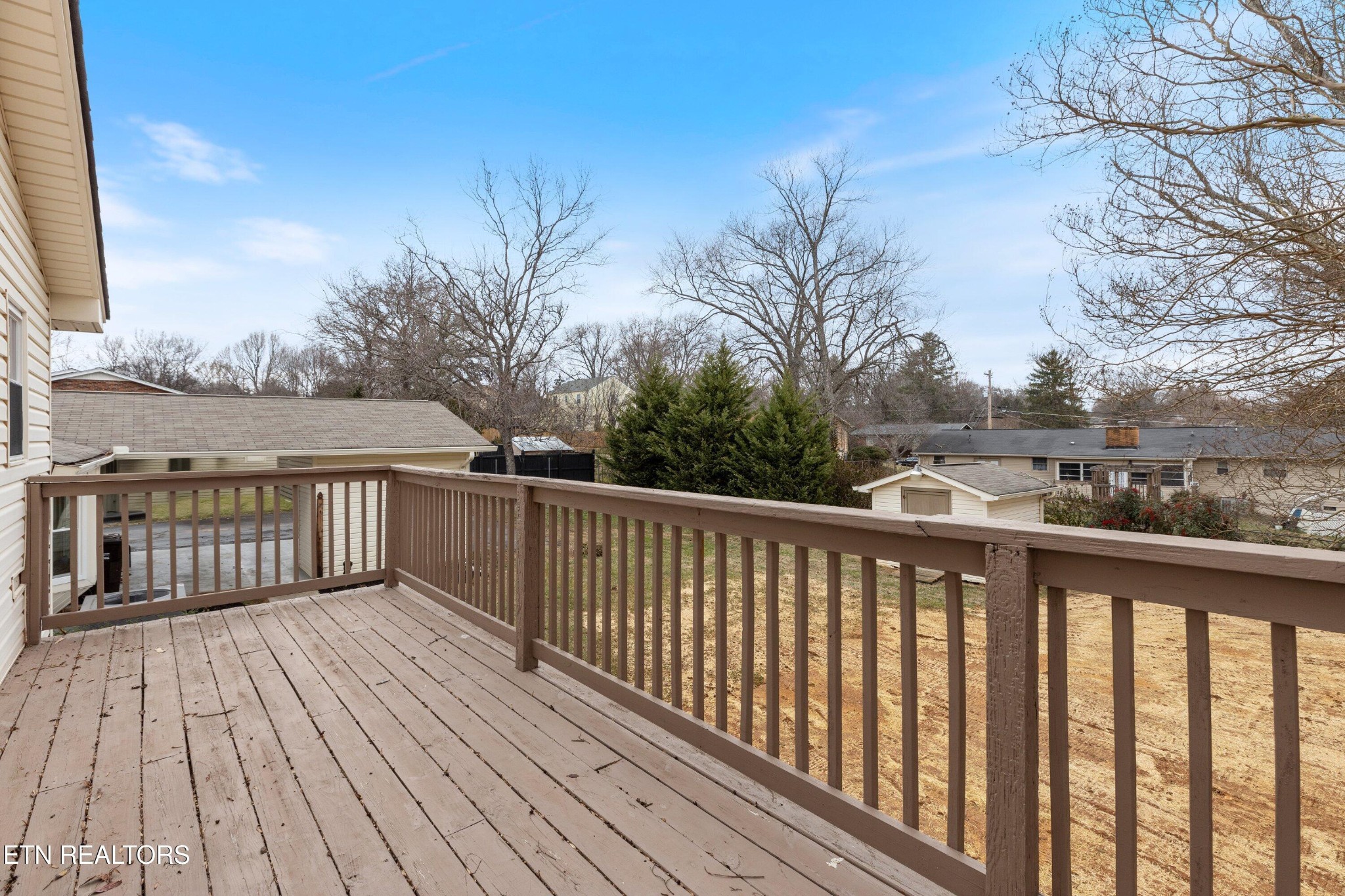 912 Naples Road Knoxville, TN 37923 - Photo 26 of 49 a balcony with wooden floor and fence