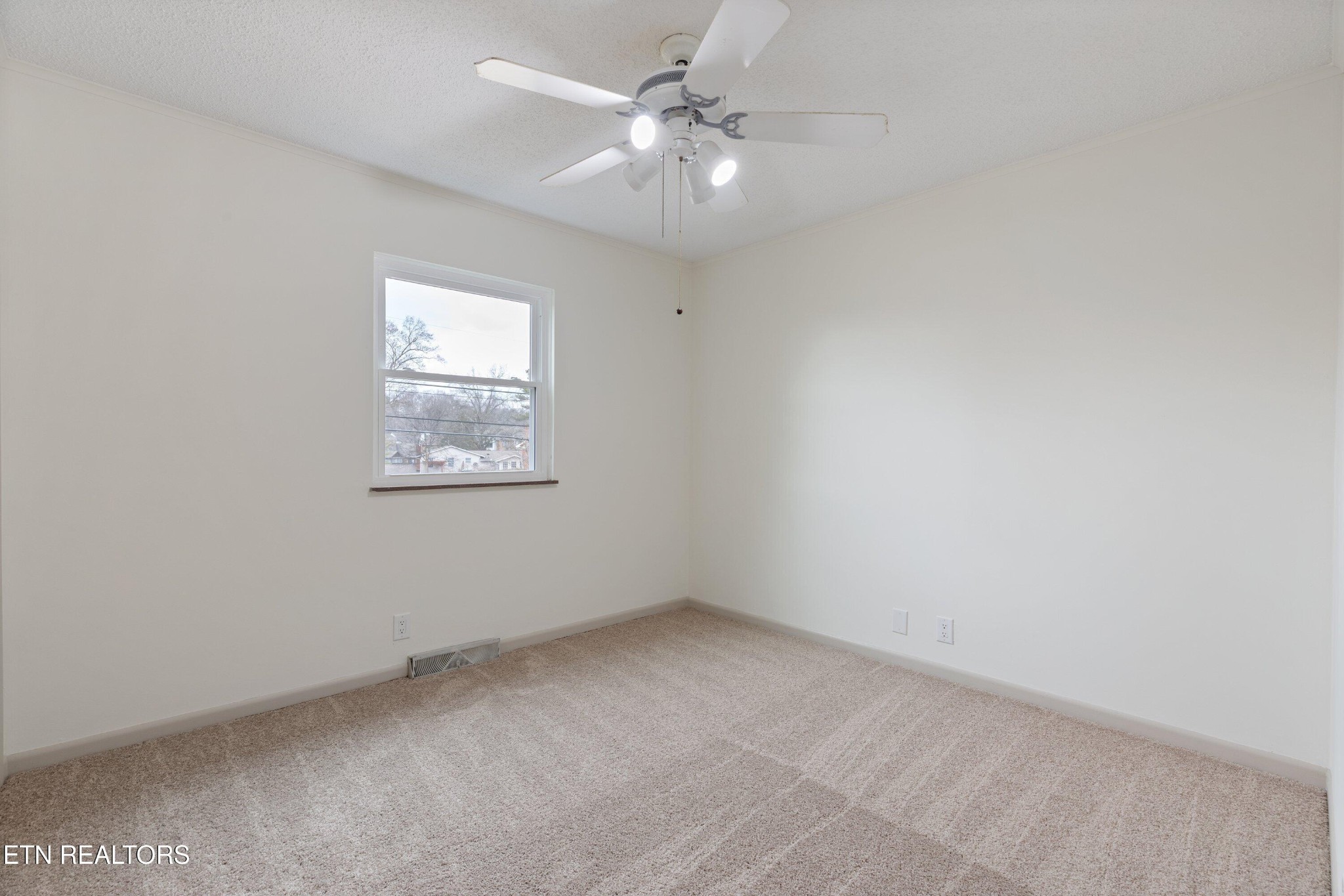 912 Naples Road Knoxville, TN 37923 - Photo 27 of 49 an empty room with a window and a fan