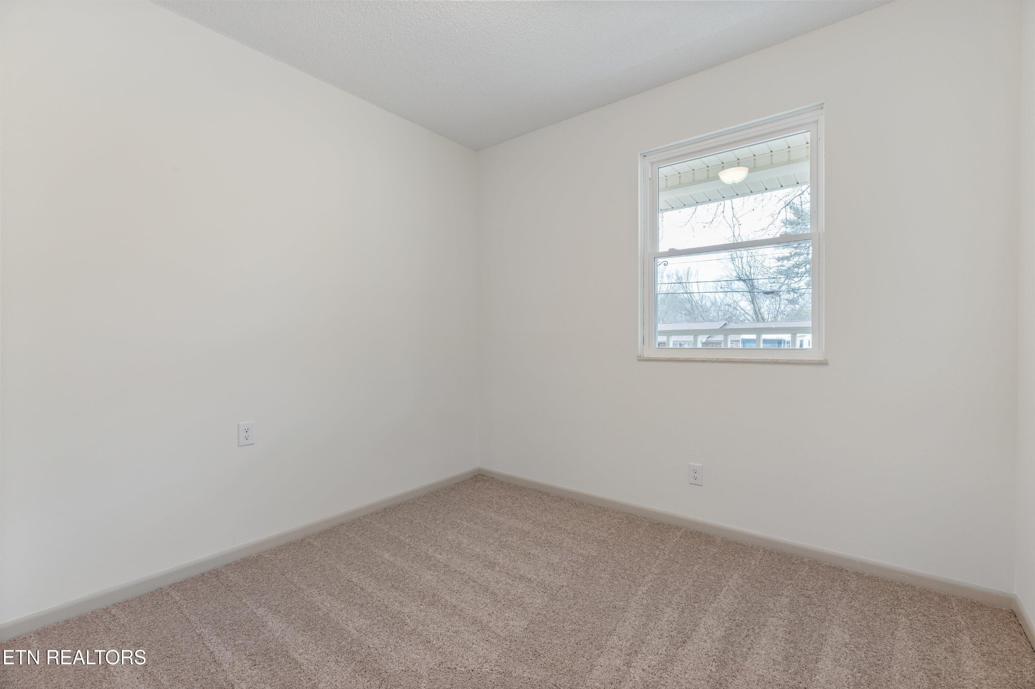 912 Naples Road Knoxville, TN 37923 - Photo 28 of 49 an empty room with a window