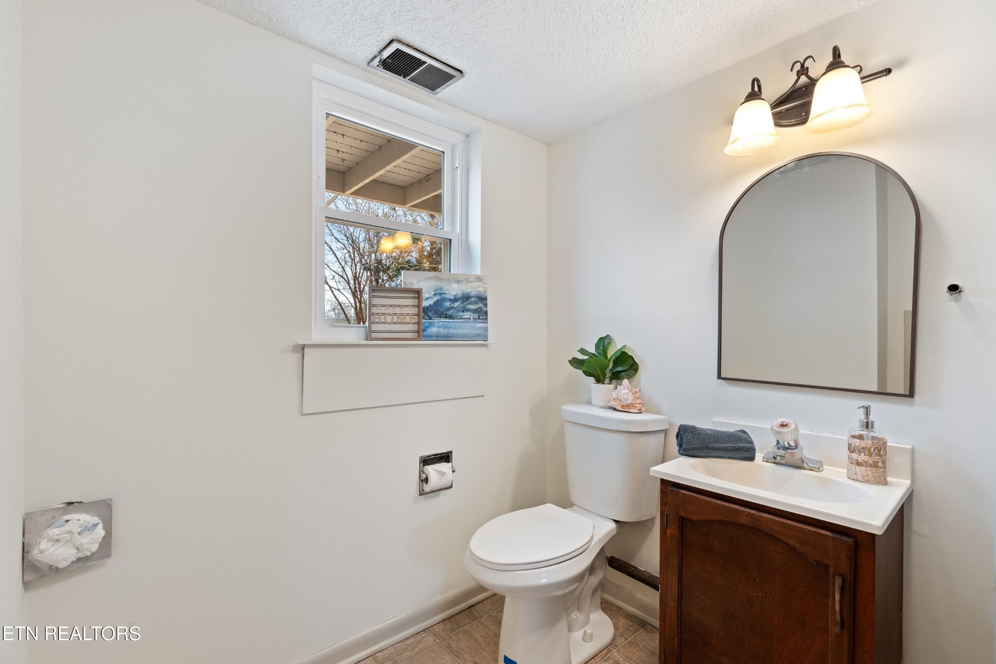 912 Naples Road Knoxville, TN 37923 - Photo 30 of 49 a bathroom with a toilet sink and mirror