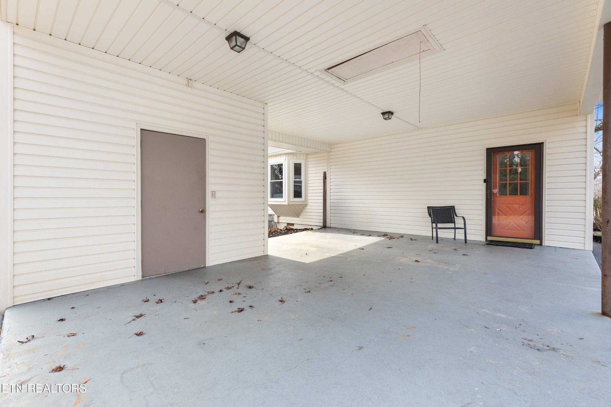 912 Naples Road Knoxville, TN 37923 - Photo 33 of 49 a view of a livingroom with kitchen space and window