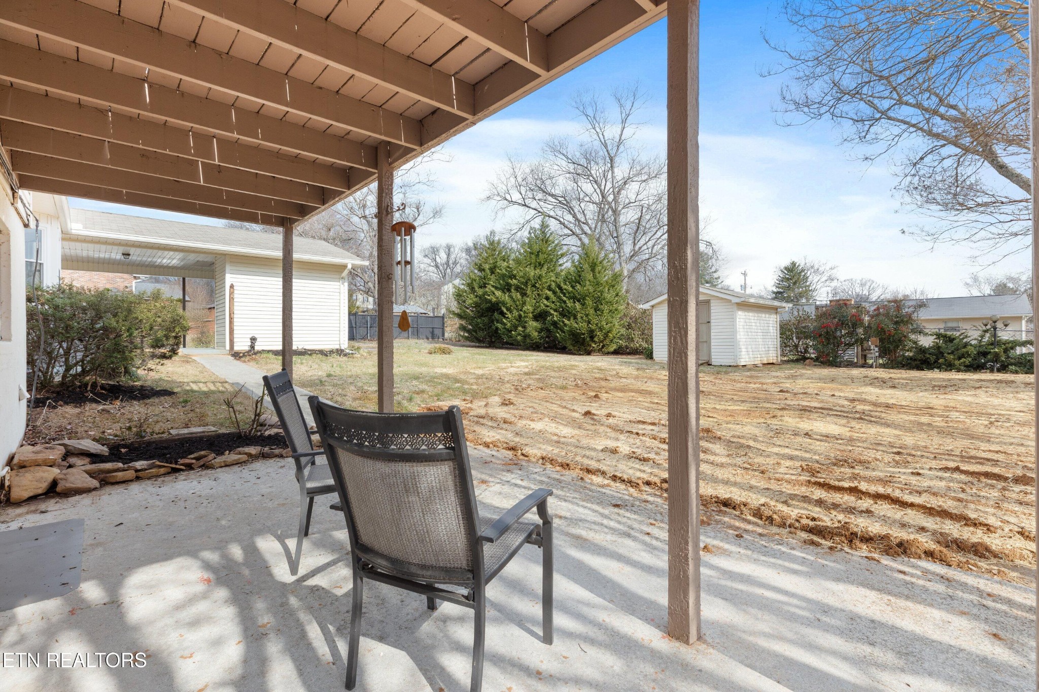 912 Naples Road Knoxville, TN 37923 - Photo 34 of 49 a view of a chair and tables in the patio