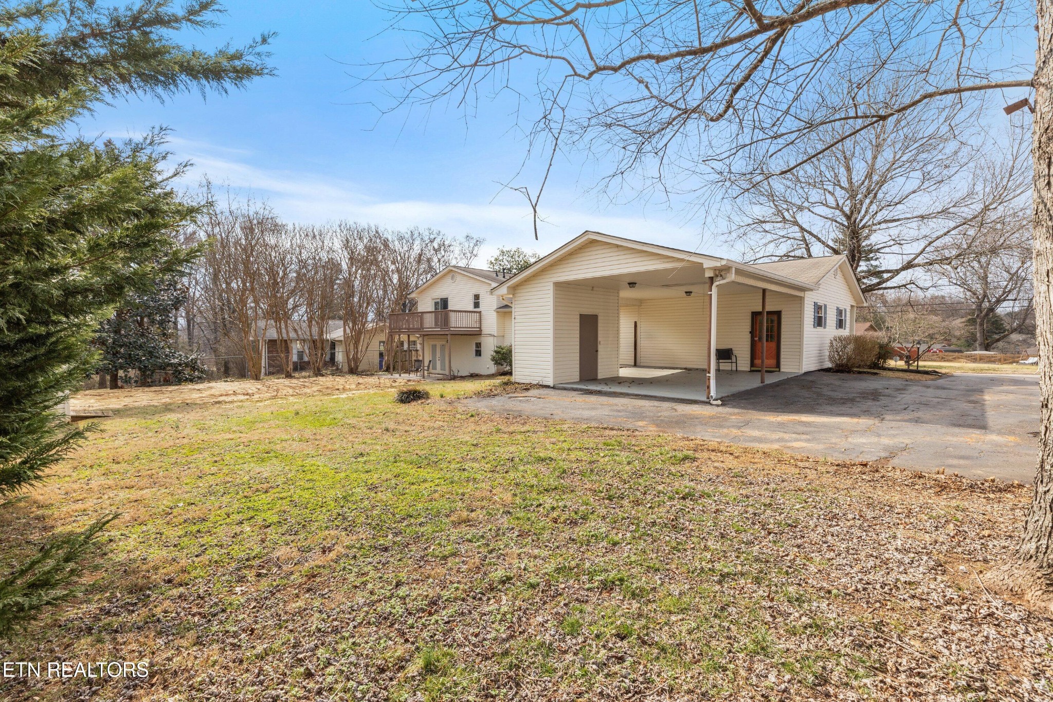 912 Naples Road Knoxville, TN 37923 - Photo 36 of 49 a front view of a house with a yard covered with snow and trees