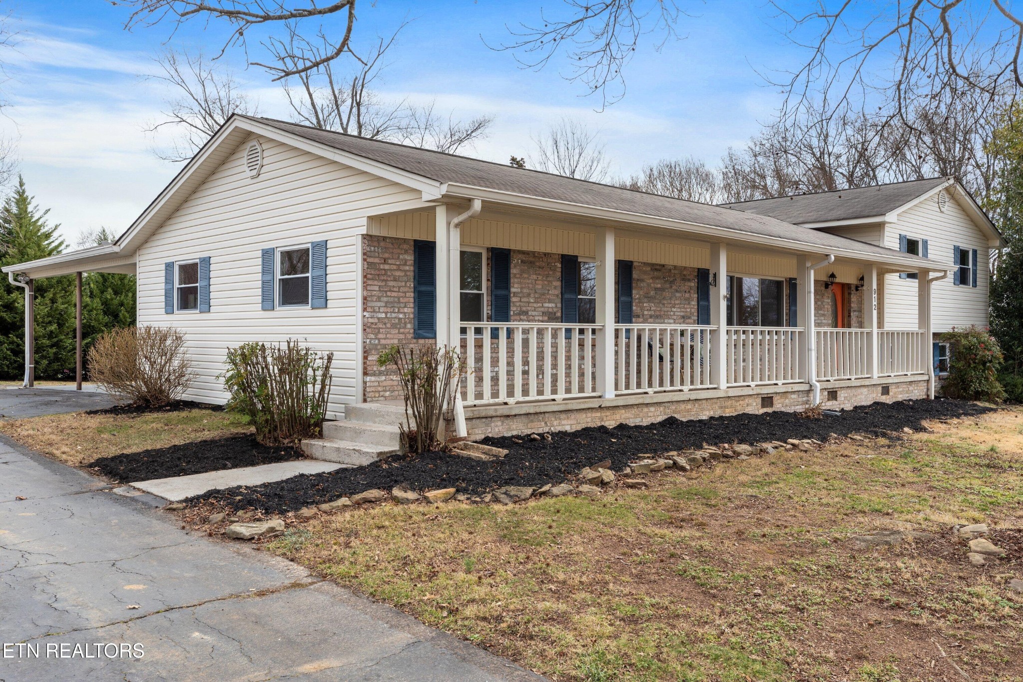 912 Naples Road Knoxville, TN 37923 - Photo 5 of 49 a front view of a house with a yard