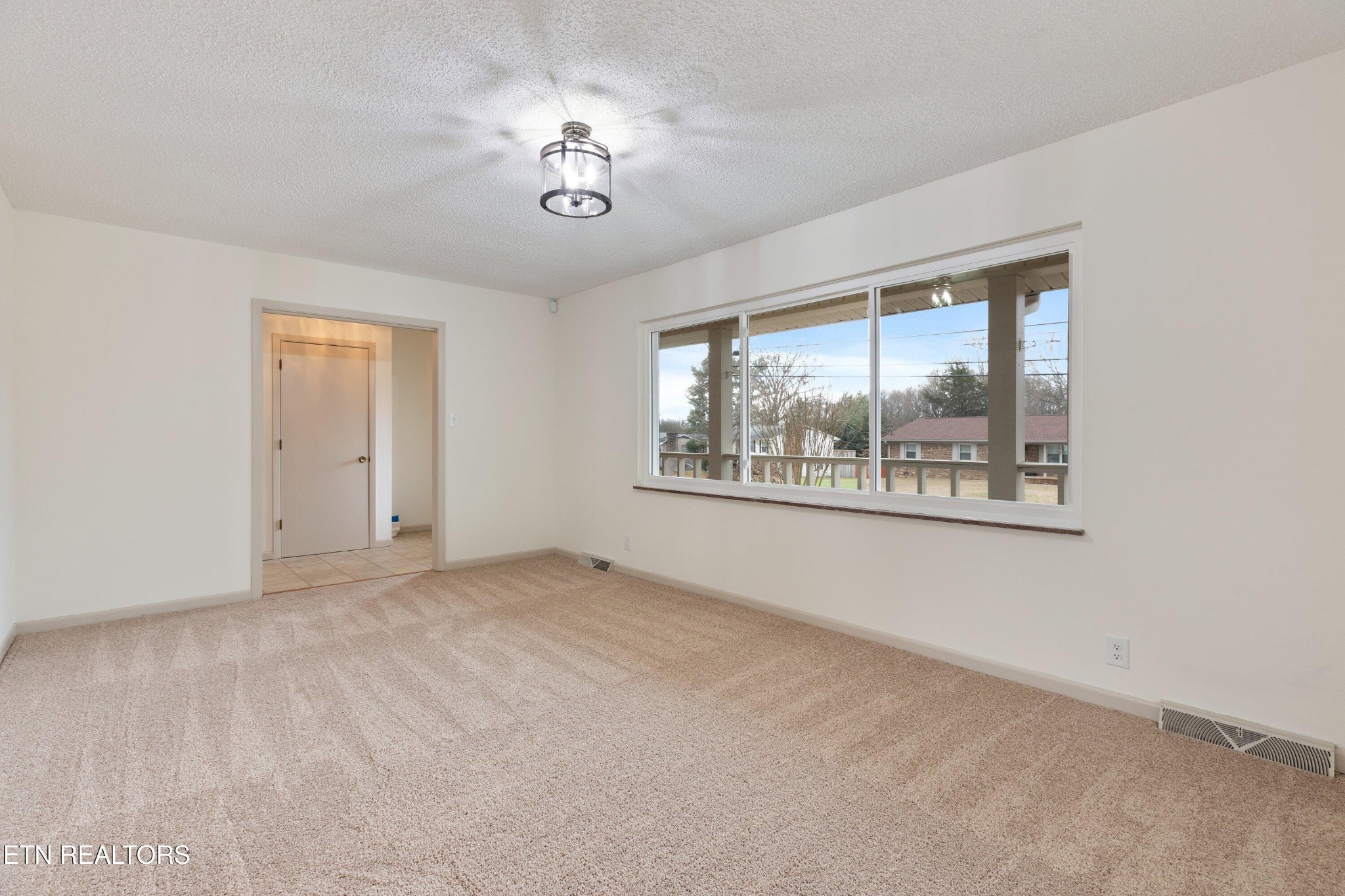 912 Naples Road Knoxville, TN 37923 - Photo 10 of 49 a view of an empty room with a window