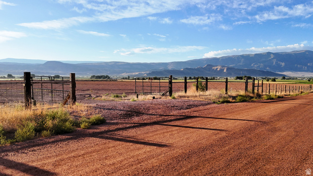 1000 East Mink Farm Road Richfield, UT 84701 - Photo 19 of 29 Expansive open field with fencing and mountain backdrop