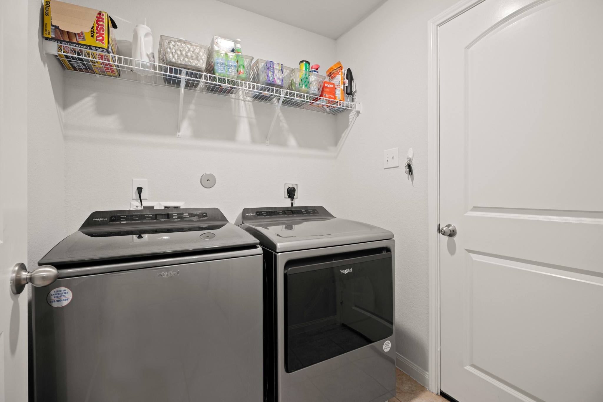 6214 El Topacio Drive Houston, TX 77048 - Photo 11 of 27 a utility room with dryer and washer